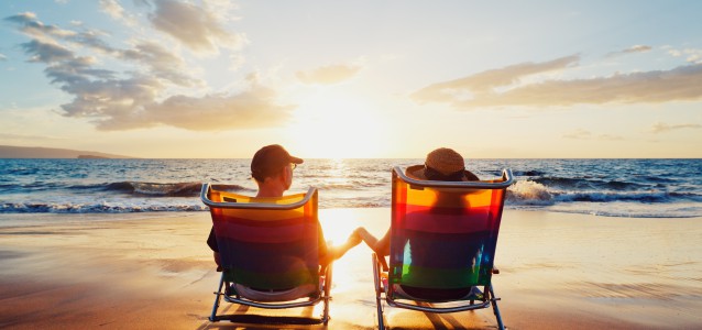 Happy Romantic Couple Enjoying Beautiful Sunset at the Beach
